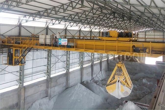 Overhead crane with grab bucket for grabbing cement.jpeg